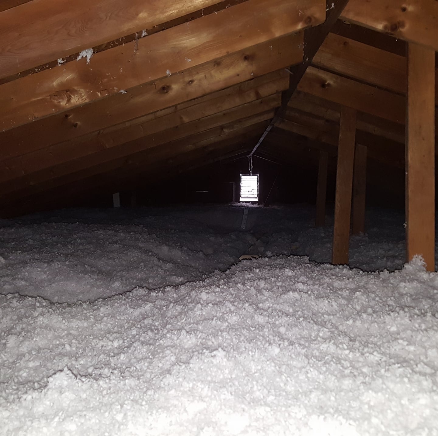 Attic with professionally installed blown-in insulation