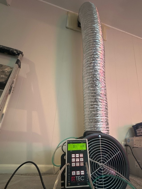 Live pressure gauge reading during an A/C duct blaster verification test